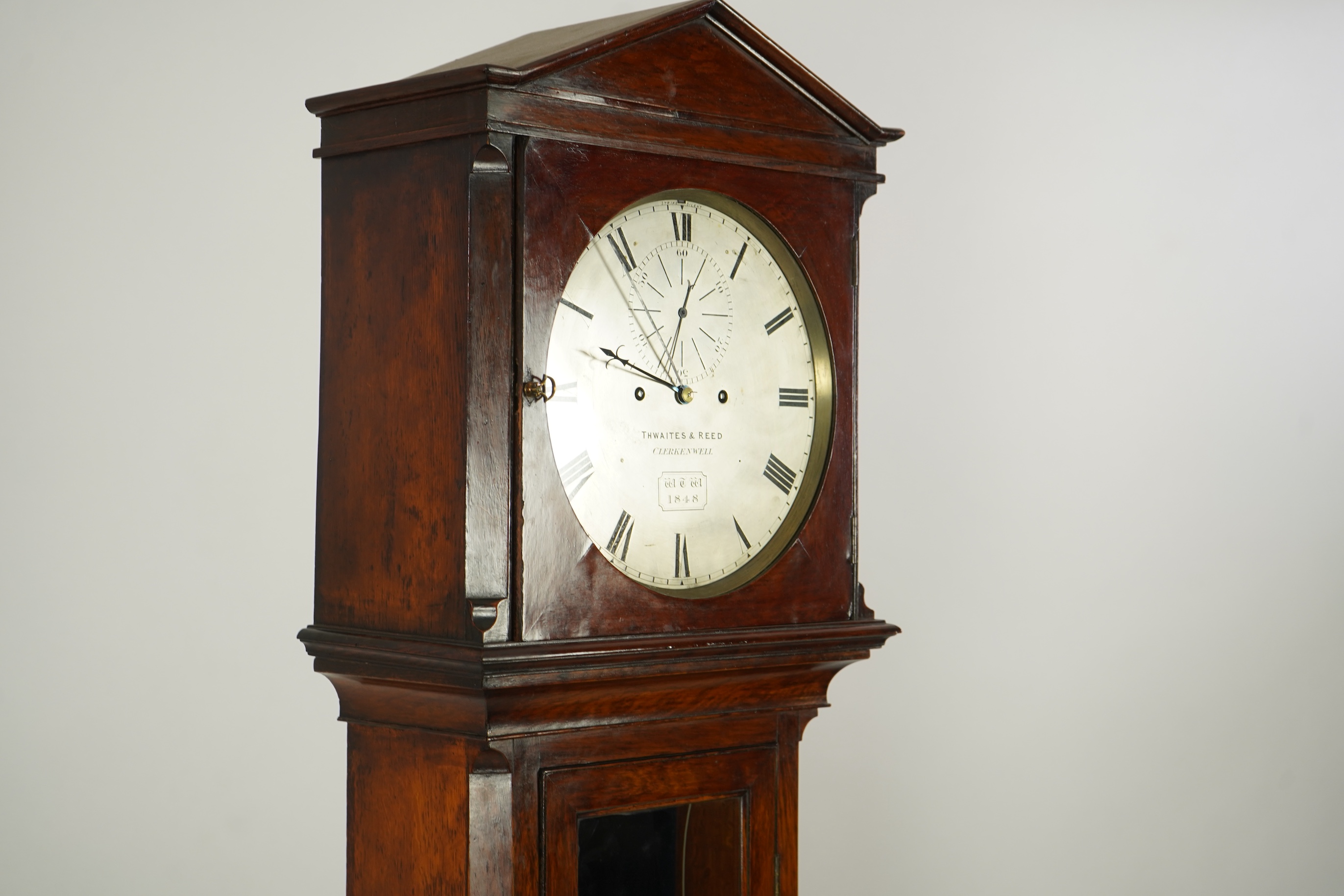 A mid 19th century oak eight day longcase regulator, circular silvered dial signed Thwaites & Reed, Clerkenwell, WTW 1848